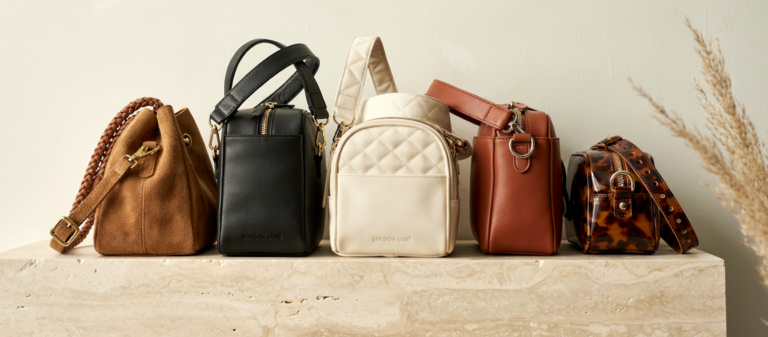 Editorial interior photograph of DIFFERENT WIDE STRAPPED CROSS BODY BAGS